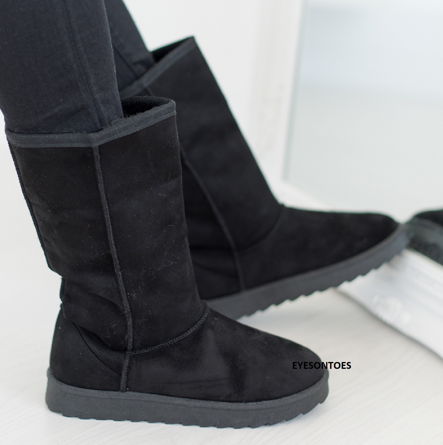 black calf hugging boots